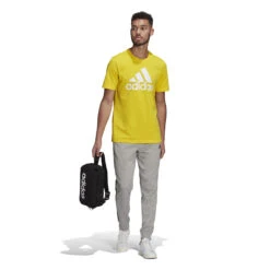 Adidas Essentials French Terry Tapered Cuff 3-Streifen Hose 10639898 15 Adidas Essentials French Terry Tapered Cuff 3-Streifen Hose 10639898 -Woehrl Populaire Boutique GK8889 6 APPAREL On Model Standard Outfit View white