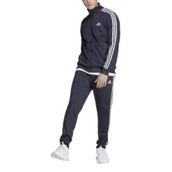 Adidas Sportswear Basic 3-Streifen Tricot Trainingsanzug 10680741 30 Adidas Sportswear Basic 3-Streifen Tricot Trainingsanzug 10680741 -Woehrl Populaire Boutique HZ2220 5 APPAREL On Model Front View transparent